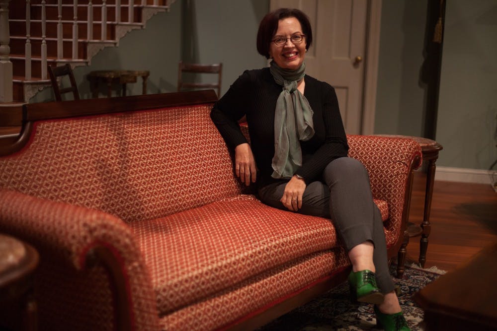 <p>Linda Pisano, chairperson of the Department of Theatre, Drama, and Contemporary Dance, poses on the set of the play, “The Heiress”, on Sept. 26 at the Ruth N. Halls Theatre. Pisano was appointed to her position in July.</p>