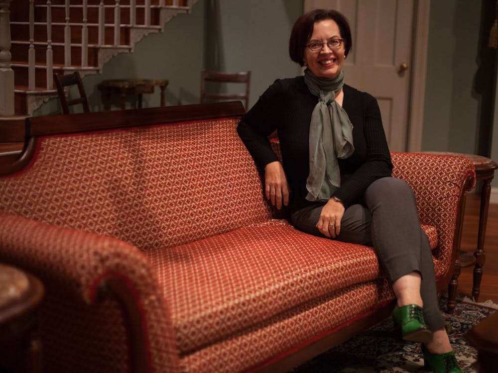 Linda Pisano, chairperson of the Department of Theatre, Drama, and Contemporary Dance, poses on the set of the play, “The Heiress”, on Sept. 26 at the Ruth N. Halls Theatre. Pisano was appointed to her position in July.