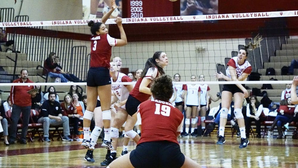 Freshman outside hitter Kamryn Malloy spikes the ball for a kill against the Wisconsin Badgers on Friday night at the University Gym. IU lost against Wisconsin and Minnesota this past weekend, dropping its overall record to 12-16.&nbsp;