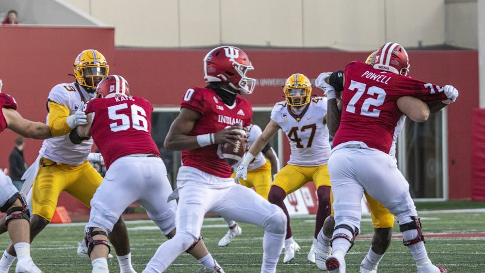 Indiana freshman quarterback Donaven McCulley looks for open receiver during the game against Minnesota on Nov. 20, 2021, at Memorial Stadium. Indiana hired Walt Bell as its new offensive coordinator Thursday.