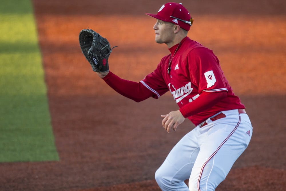 <p>Junior Elijah Dunham prepares to catch the ball at first base March 7 at Bart Kaufman Field. IU won the first game Saturday 9-2 and lost the second game 6-2 against the University of San Diego.</p>