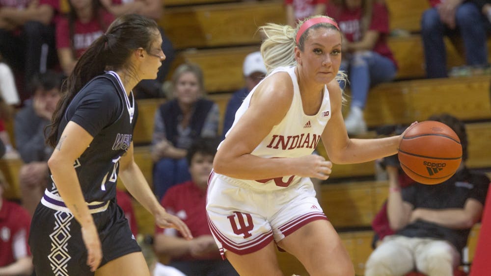 Junior guard Sydney Parrish dribbles past a Kentucky Wesleyan player Nov. 4, 2022, at Simon Skjodt Assembly Hall. The Hoosiers defeated Nebraska in overtime on Jan. 1, 2023, after the score was tied at 62 all at the end of regulation.