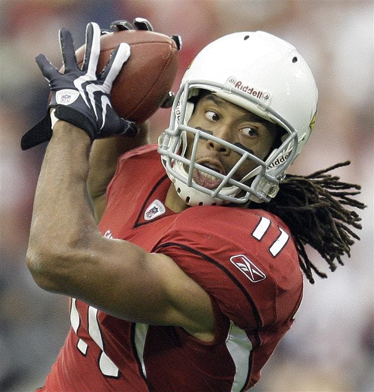Arizona Cardinals wide receiver Larry Fitzgerald catches a touchdown pass  during the first half of the NFC championship football game against the Philadelphia Eagles Sunday in Glendale, Ariz.