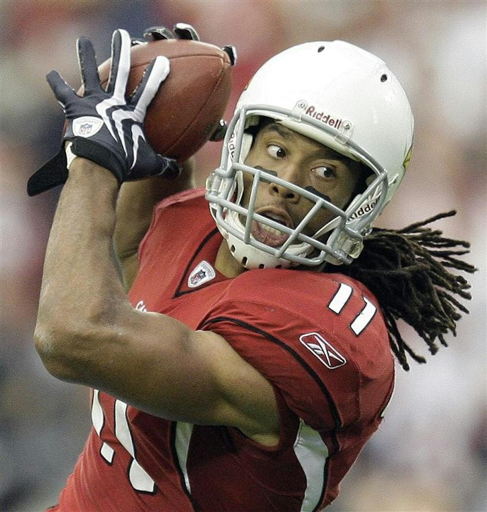 Arizona Cardinals wide receiver Larry Fitzgerald catches a touchdown pass  during the first half of the NFC championship football game against the Philadelphia Eagles Sunday in Glendale, Ariz.