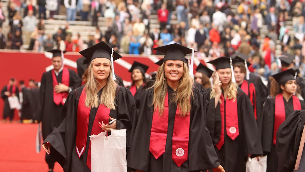 Two students walk May 7, 2022, on the field of Memorial Stadium after the the undergraduate graduation ceremony. The IU 2023 Spring Undergraduate Commencement Ceremony will be held at 10 a.m. May 6, 2023, at the Memorial Stadium. 
