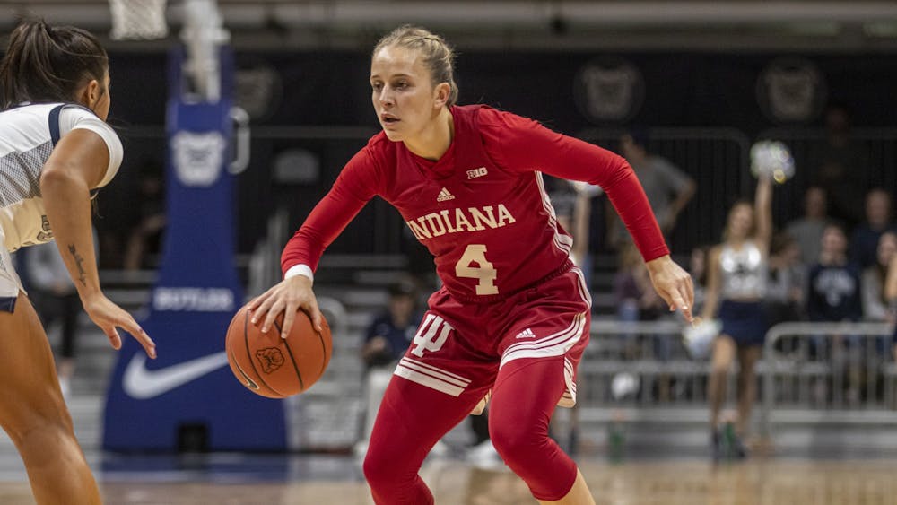 IU graduate guard Nicole Cardaño-Hillary attempts to dribble around a defender during the game against Butler University on Nov. 10, 2021, at Hinkle Fieldhouse. Cardaño-Hillary scored at team-high 29 points in the win against Butler.