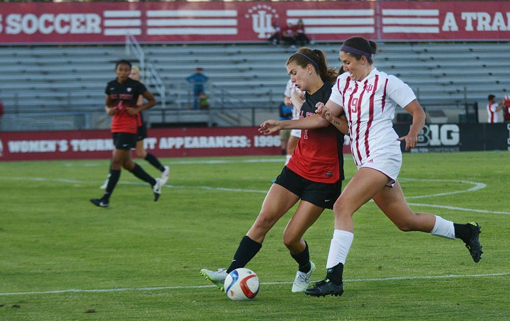 Junior forward Lauren Joray works thorugh the Ball State University Cardinals' defense at Bill Armstrong stadium on Sunday evening. The game ended in a 1-1 draw.