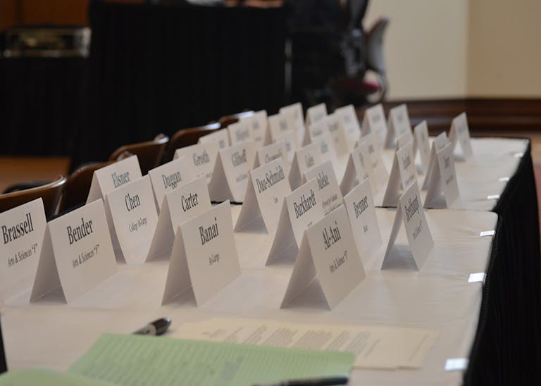 Before the Bloomington Faculty Council meeting begins, participants check in at the front table of President's Hall. Indiana University staff and Bloomington residents gathered in President's Hall for the meeting on Tuesday afternoon.
