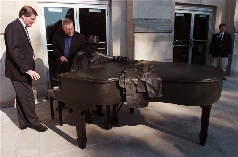 IU Jacobs School Dean Gwyn Richards, left, and Associate Executive Dean Eugene O'Brien take a look at a sculpture of Hoagy 