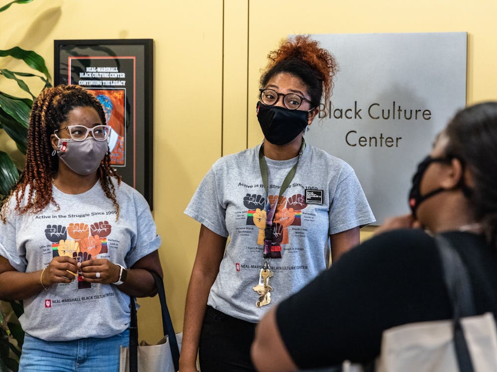 Graduate assistants Dionne White and Brandi Loving greet a student Aug. 23, 2021, during the Neal-Marshall Black Culture Center open house. The event was the center&#x27;s first in-person activity in more than a year. 