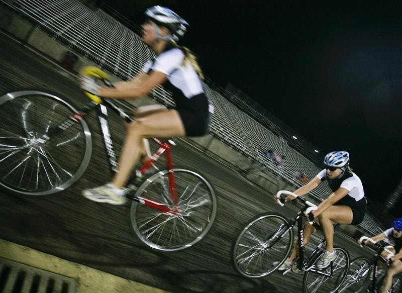 Juniors Jenna Cerone and Jennifer Balbach lead down the straightaway Saturday evening at Bill Armstrong Stadium. Kappa Delta beat Kappa Alphe Theta in the final women's heat of the event.