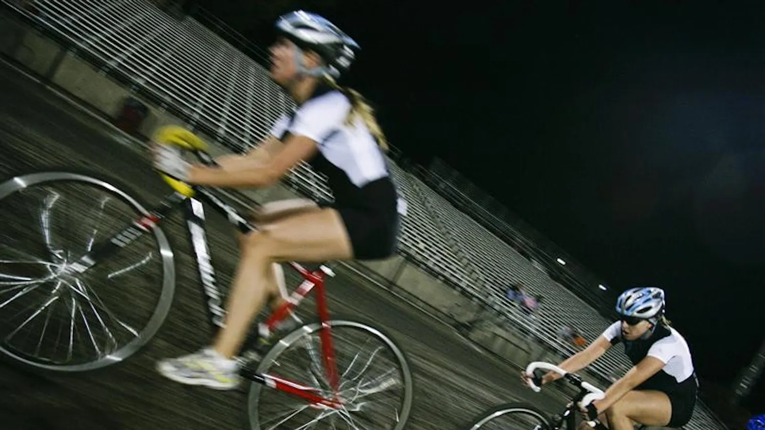 Juniors Jenna Cerone and Jennifer Balbach lead down the straightaway Saturday evening at Bill Armstrong Stadium. Kappa Delta beat Kappa Alphe Theta in the final women's heat of the event.