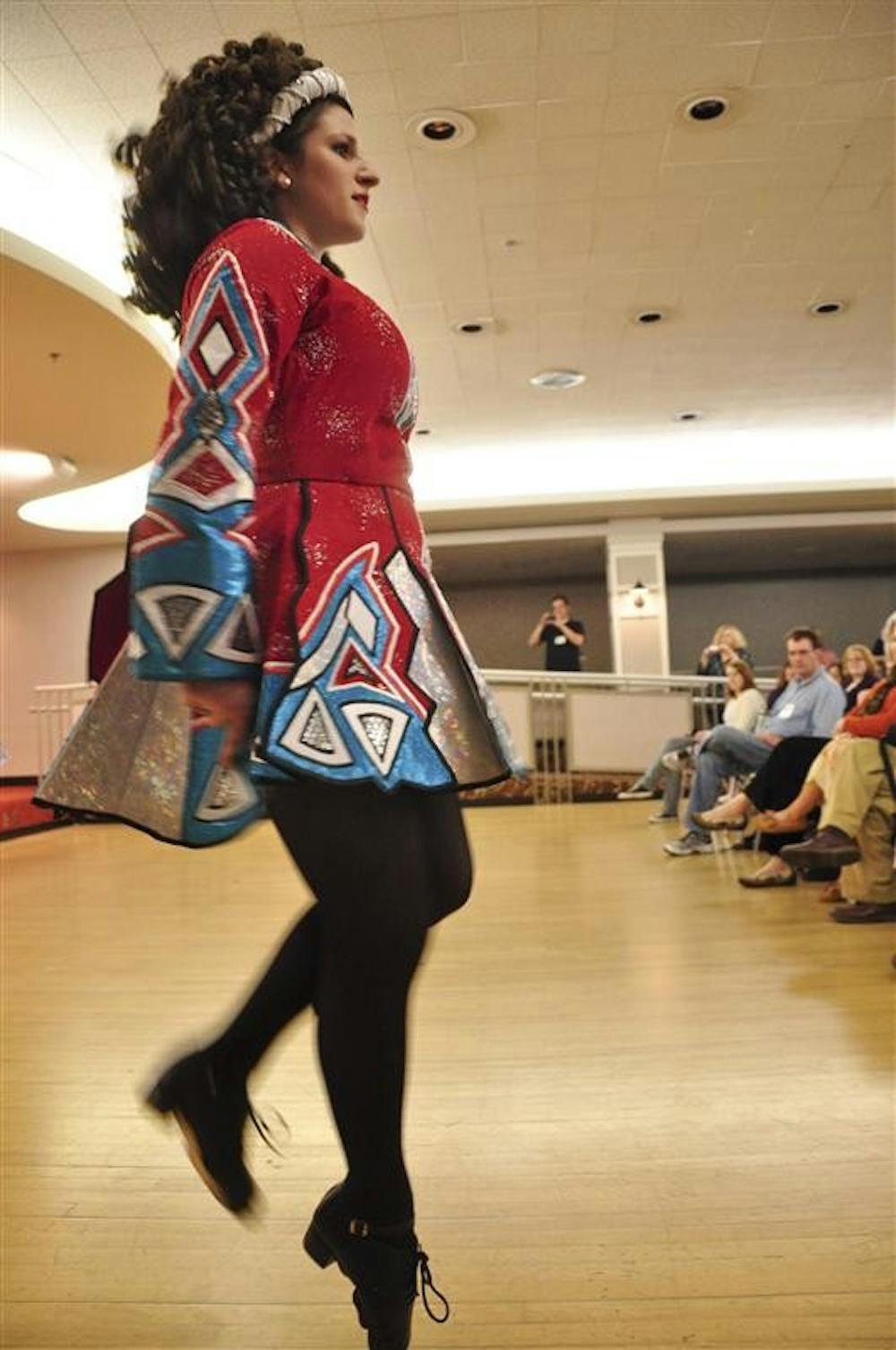 Sophomore Loren Twigg performs a dance Saturday in the Frangipani Room as part of Celtic Culture Weekend. The IU Identity Irish Dancers gave a demonstration wearing both soft shoes, which are similar to ballet pointe shoes, and hard shoes which have fiberglass bottoms unlike tap and clogging shoes.