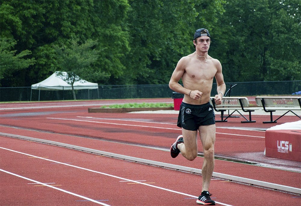 Daniel Kuhn warms up Thursday afternoon at the Billy Hayes Track. He prepared for the NCAA Outdoor Championships next week.