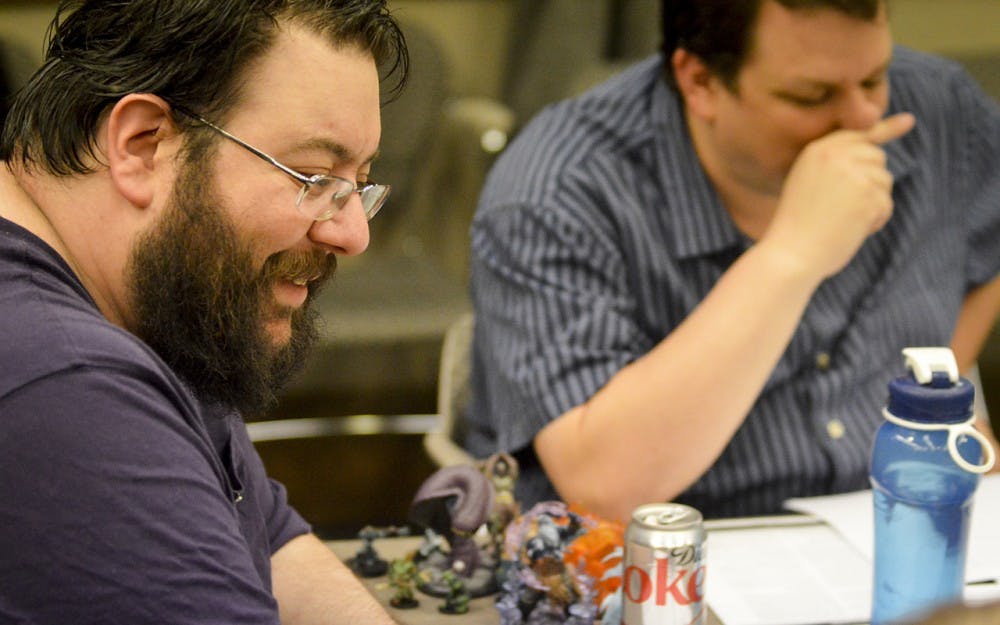 Pathfinder Society Venture Captain Mike Bramnik discusses gaming strategy during Union Board’s comics and gaming event Friday evening in the IMU.