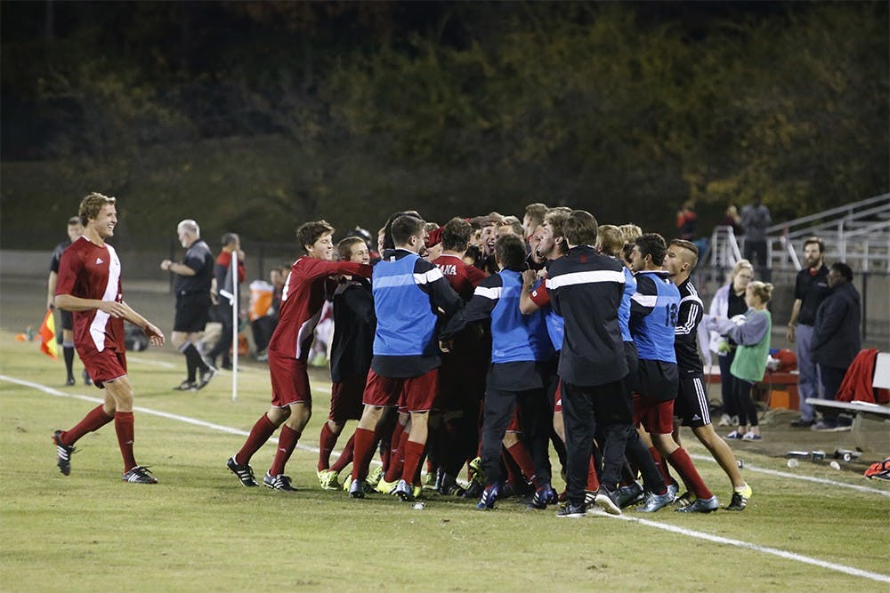 The IU Hoosiers celebrate after scoring a goal during IU's game against Louisville Tuesday night at the Bill Armstrong Stadium. IU won 2-1.