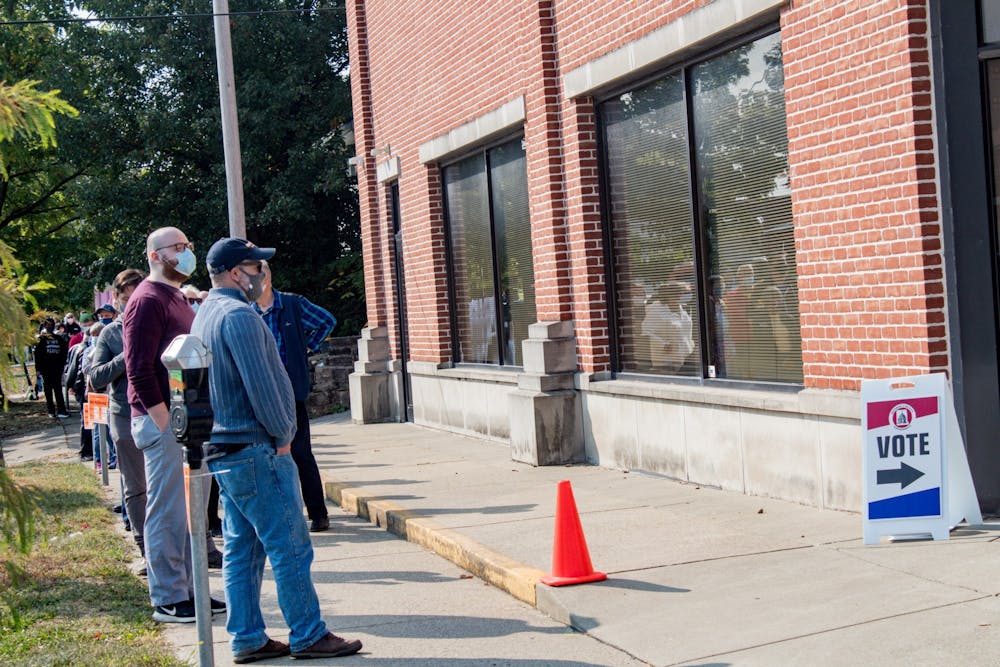 <p>Early voters wait in line to cast their votes Oct. 6, 2020, at 401 W. Seventh St. Early in-person voting for Indiana opened Oct. 12 and is available in Bloomington at 302 S. Walnut St.</p>