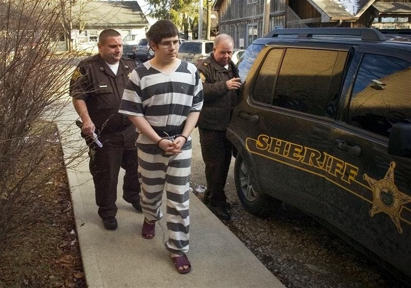 Bennie Reed, 17, is escorted to the Brown County Courthouse for a hearing in Nashville, Ind. Friday. Reed has been charged with 11 felonies, including murder, attempted murder and conspiracy to commit murder. Police allege that Reed shot to death Richard Voland, 84, on Nov. 15, 2007 after swindling his way into the residence to get alcohol. Another teen, who is 13 and has not been publicly identified by officials, faces charges in juvenile court.