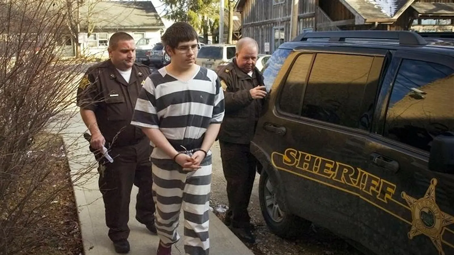 Bennie Reed, 17, is escorted to the Brown County Courthouse for a hearing in Nashville, Ind. Friday. Reed has been charged with 11 felonies, including murder, attempted murder and conspiracy to commit murder. Police allege that Reed shot to death Richard Voland, 84, on Nov. 15, 2007 after swindling his way into the residence to get alcohol. Another teen, who is 13 and has not been publicly identified by officials, faces charges in juvenile court.