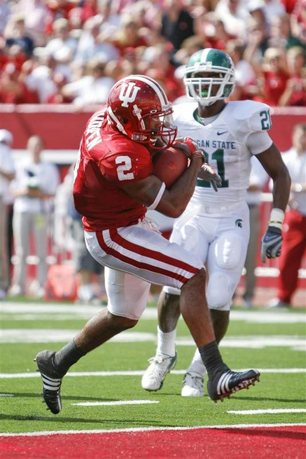 Senior running back Marcus Thigpen scores one of his three touchdowns during the Hoosiers' 42-29 loss to Michigan State Saturday afternoon at Memorial Stadium. Thigpen finished with 207 total yards.
