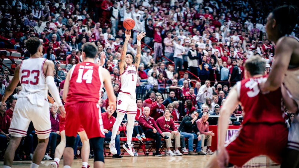 Then-freshman guard Jalen Hood-Schifino shoots a three on Jan. 14, 2023, at Simon Skjodt Assembly Hall in Bloomington. Hood-Schifino and Indiana forward Trayce Jackson-Davis were selected in the first and second rounds of Thursday&#x27;s 2023 NBA Draft, respectively. 