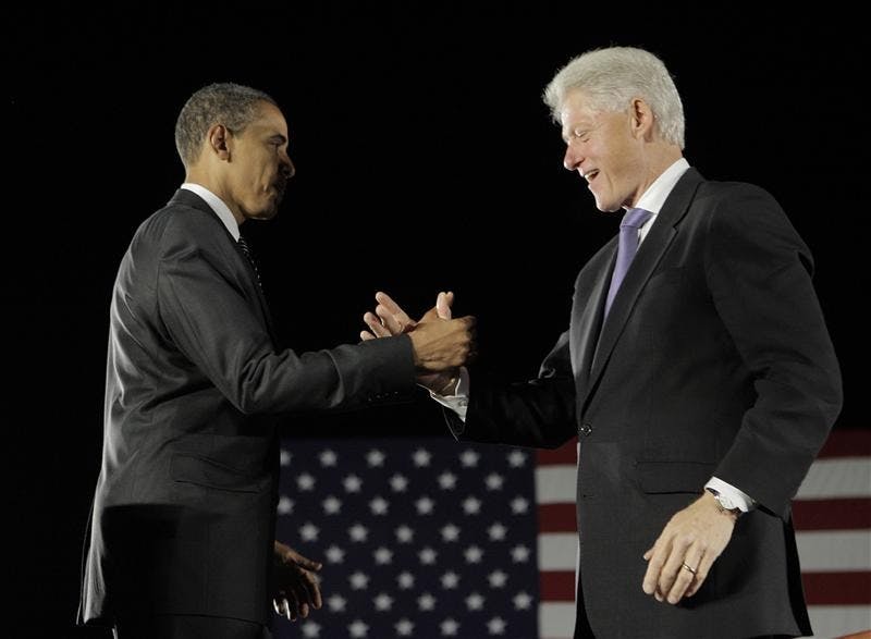 Democratic presidential candidate Sen. Barack Obama, D-Ill., left, shakes hands with former President Bill Clinton after addressing supporters on Wednesday at a rally in Kissimmee, Fla.
