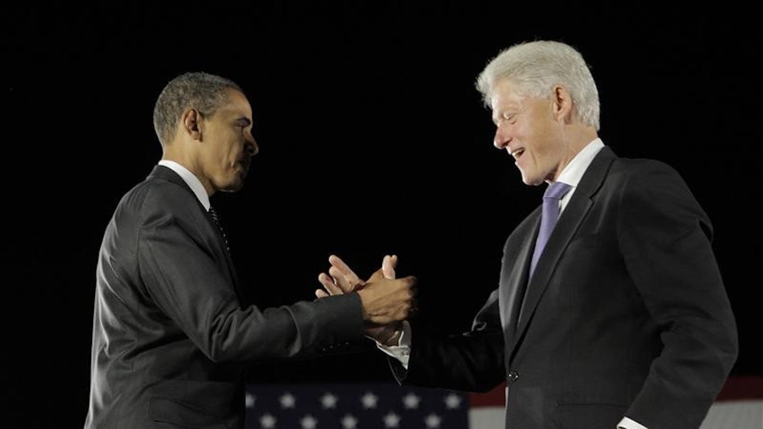 Democratic presidential candidate Sen. Barack Obama, D-Ill., left, shakes hands with former President Bill Clinton after addressing supporters on Wednesday at a rally in Kissimmee, Fla.