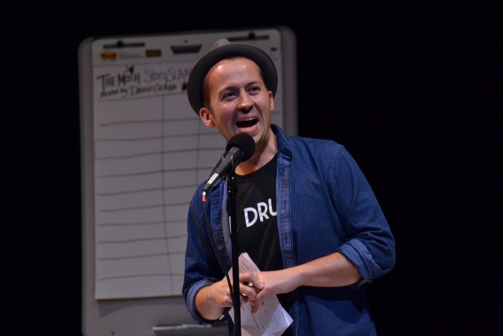 Host David Crabb opens the show during the Moth StorySLAM Wednesday evening at the Wells-Metz Theatre. The Moth is a not-for-profit organization that produces a national broadcast program that allows story tellers a chance to publically share their stories.