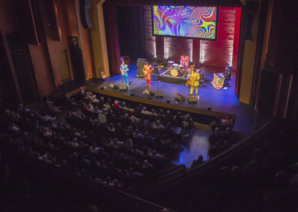The Mersey Beatles play their set Friday night at the Buskirk-Chumley Theater, which was packed for the tribute band's third performance in Bloomington. All of the Mersey Beatles are from from Liverpool, the hometown of the original Beatles quartet. 