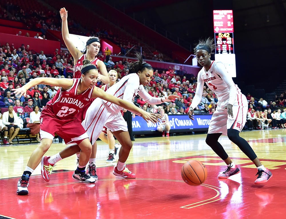 Sophomore guard Alexis Gassion lunges for the ball during IU's game at Rutgers on Sunday. IU lost 71-60. 