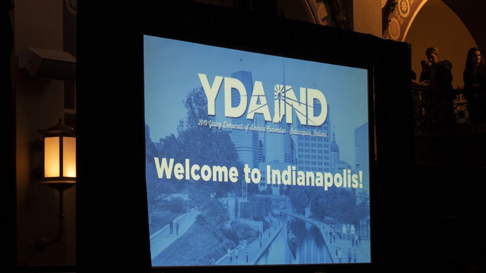 A screen reads, “Welcome to Indianapolis,” on July 19 at the Crowne Plaza in Indianapolis. House Speaker Nancy Pelosi spoke at the 2019 Young Democrats of America National Convention.