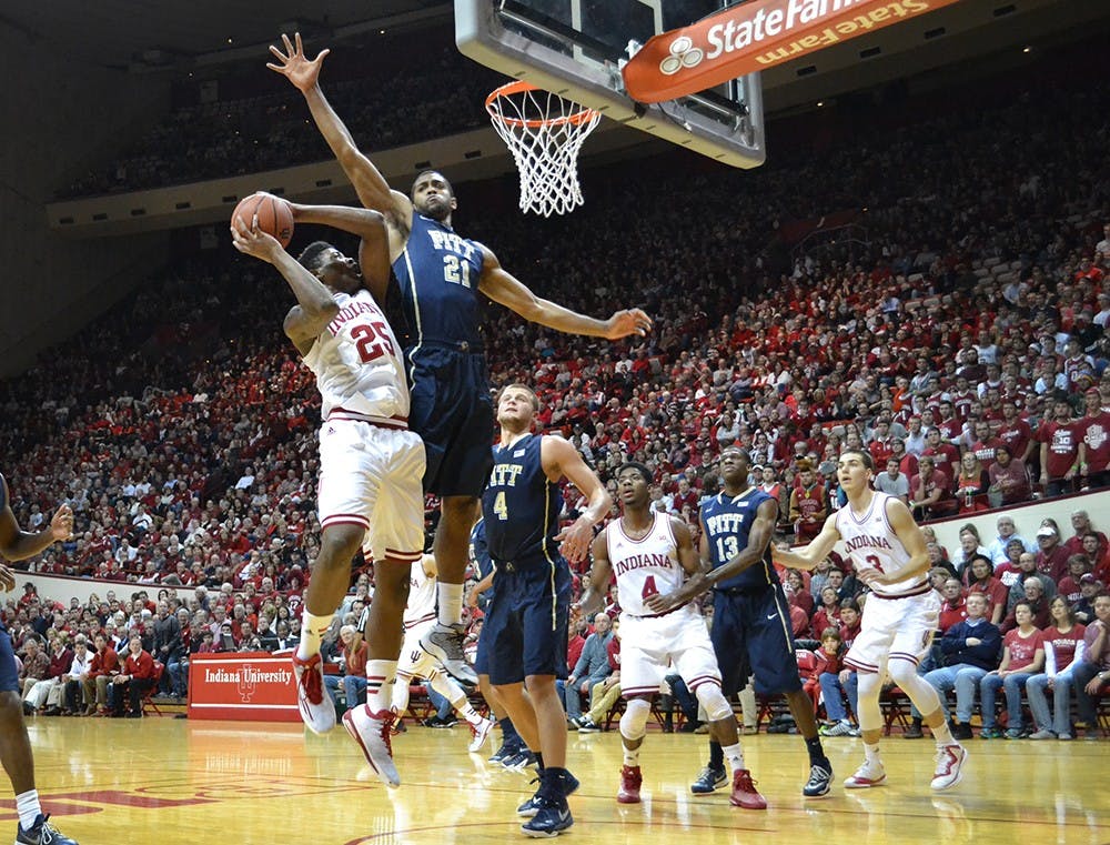 Freshman Emmit Holt has his shot contested by a Pittsburgh player during IU's game against the Panthers on Tuesday at Assembly Hall.