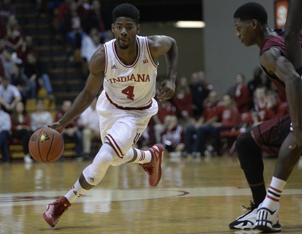 Freshman guard Robert Johnson dribbles around a defender during a game against University of Indianapolis on Monday. Johnson had 15 points and 10 rebounds in a 76-63 win.