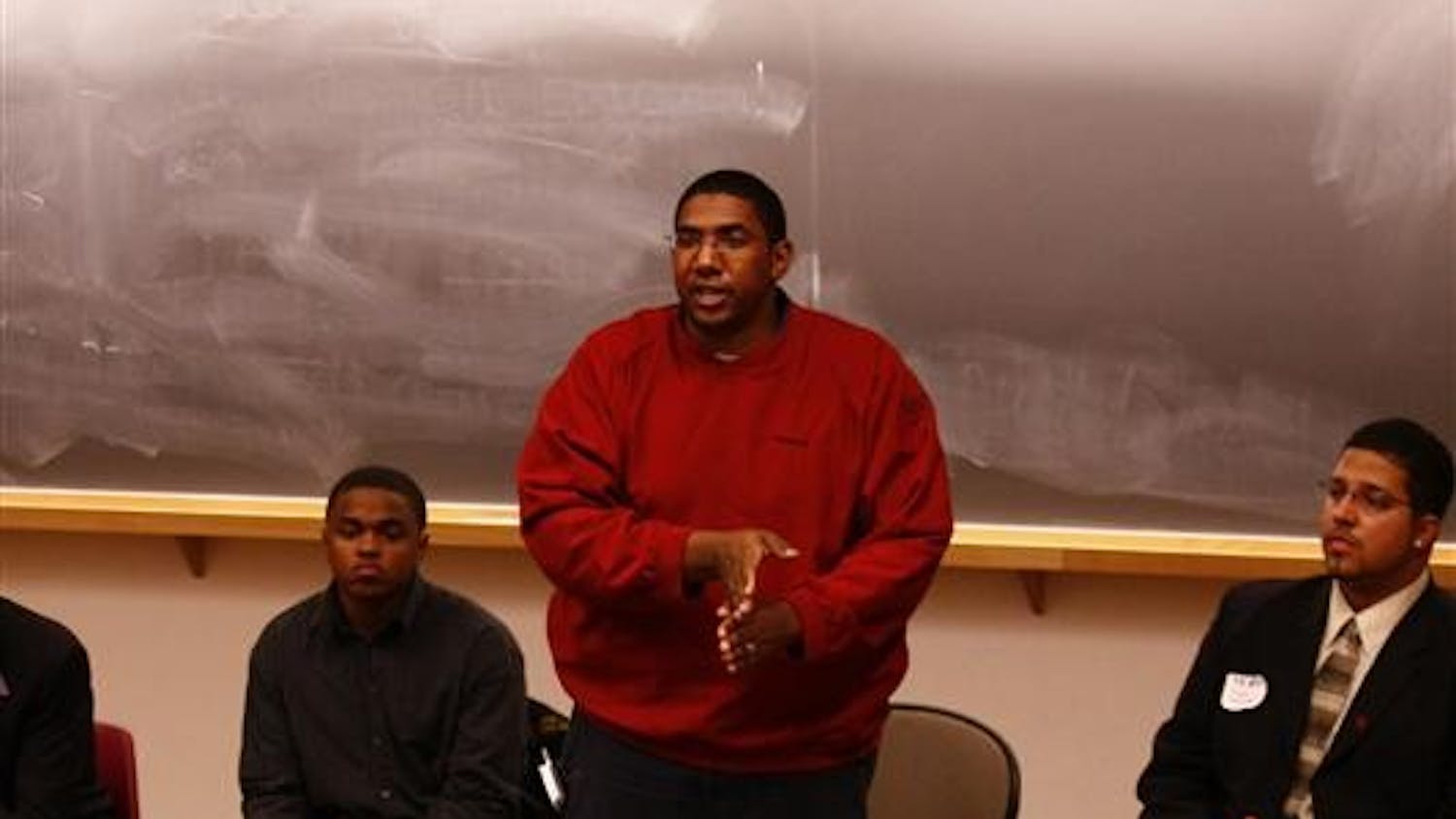 Reverend Jermaine Robinson speaks about mentoring within the African American community during the Men of Color Leadership Conference Friday afternoon at the Neal Marshall Black Cultural Center.