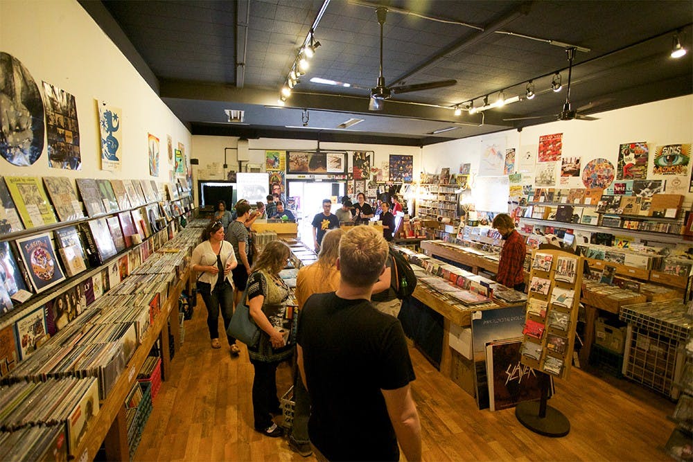 Customer pick out records on Record Store Day at Landlocked Music on April 18, 2015.