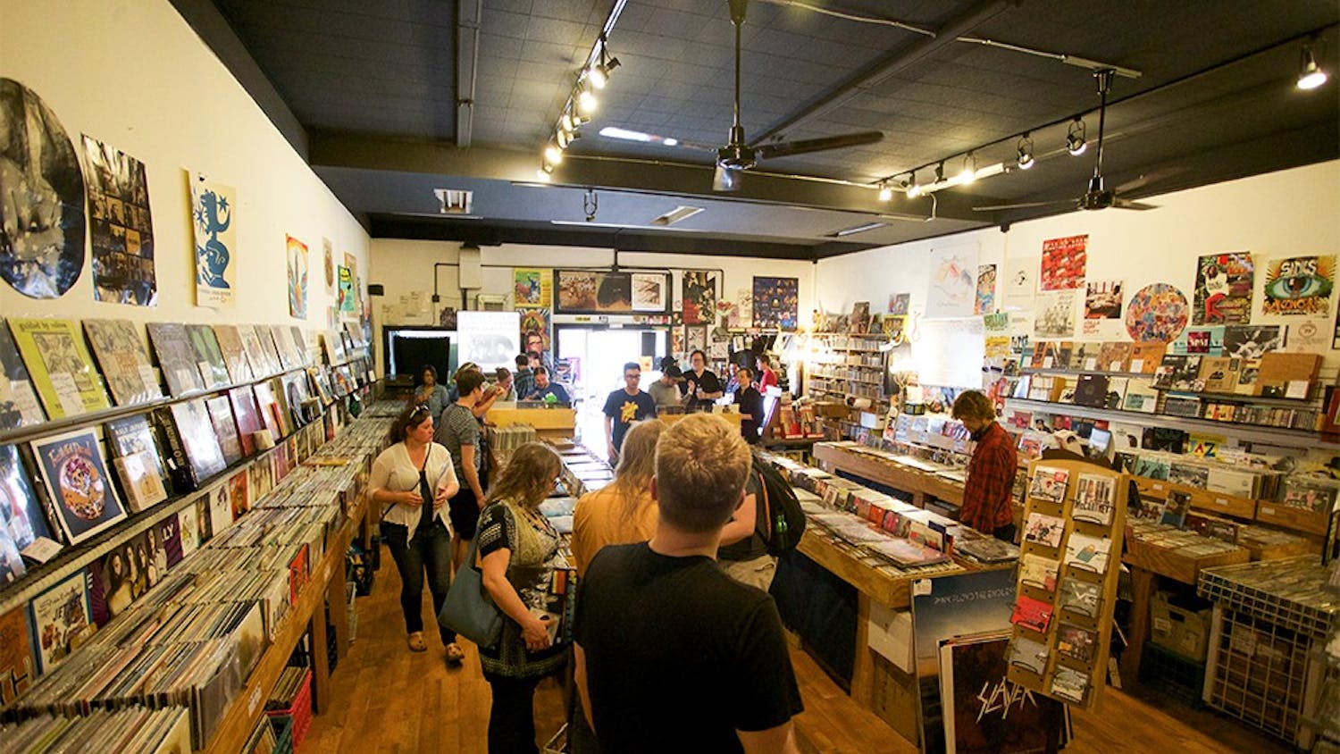 Customer pick out records on Record Store Day at Landlocked Music on April 18, 2015.
