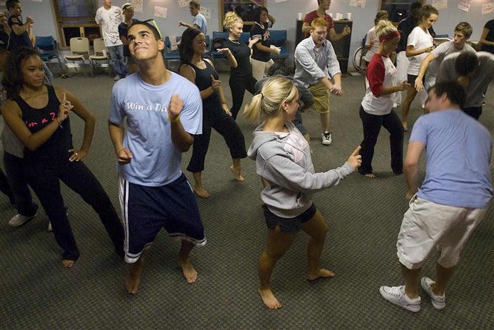 Members of sorority Zeta Tau Alpha and various fraternities rehearse on Wednesday for Big Man On Campus at the Zeta sorority house.