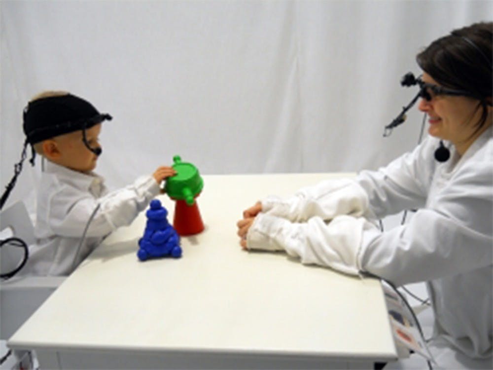 IU psychologists use head-mounted cameras to track interaction between children and caregivers. The study found a correlation may exist between distracted caregivers and children's low attention spans.