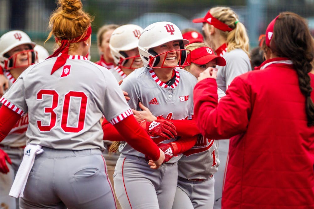 <p>IU cheers after senior Gabbi Jenkins scores and ends the game in the bottom of the seventh inning. IU defeated Miami University 1-0 in its home opener March 10 at Andy Mohr Field.</p>