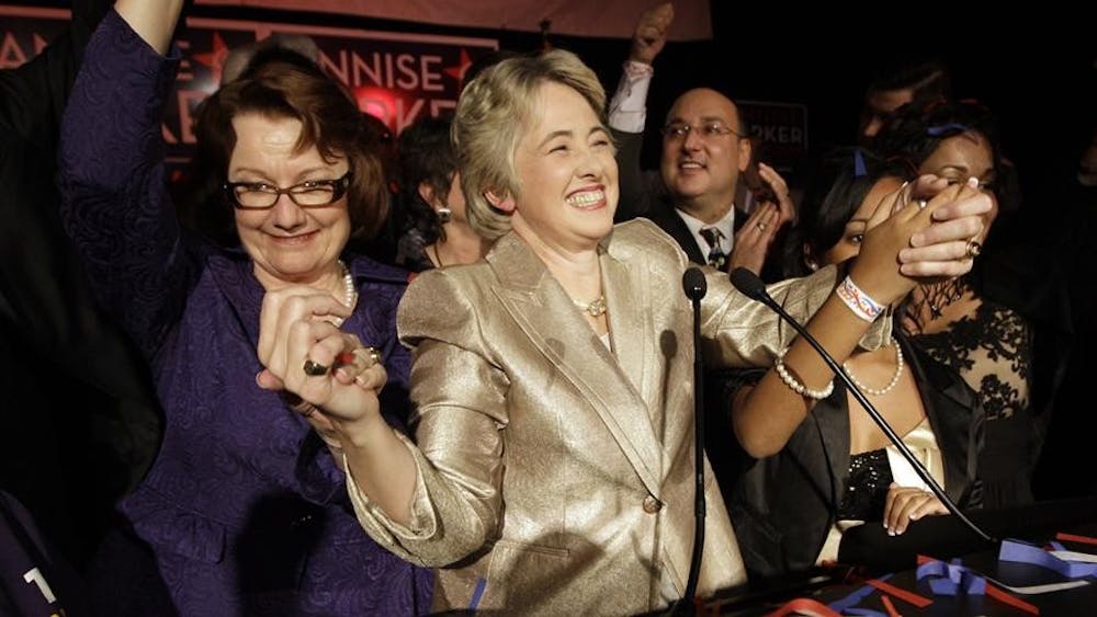 Houston mayor-elect Annise Parker, center, celebrates her runoff election victory Saturday with her partner Kathy Hubbard, left, at a campaign party in Houston. Parker defeated former city attorney Gene Locke making Houston the largest U.S. city to elect an openly gay mayor.