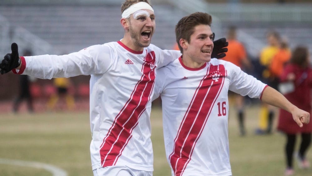 Then-senior A.J. Palazzolo and then-redshirt junior Joe Schmidt celebrate after a game in 2019 at Bill Armstrong Stadium. The Hoosiers&#x27; game against the Penn State Nittany Lions scheduled for March 7 has been postponed due to positive COVID-19 tests in the Penn State program. 