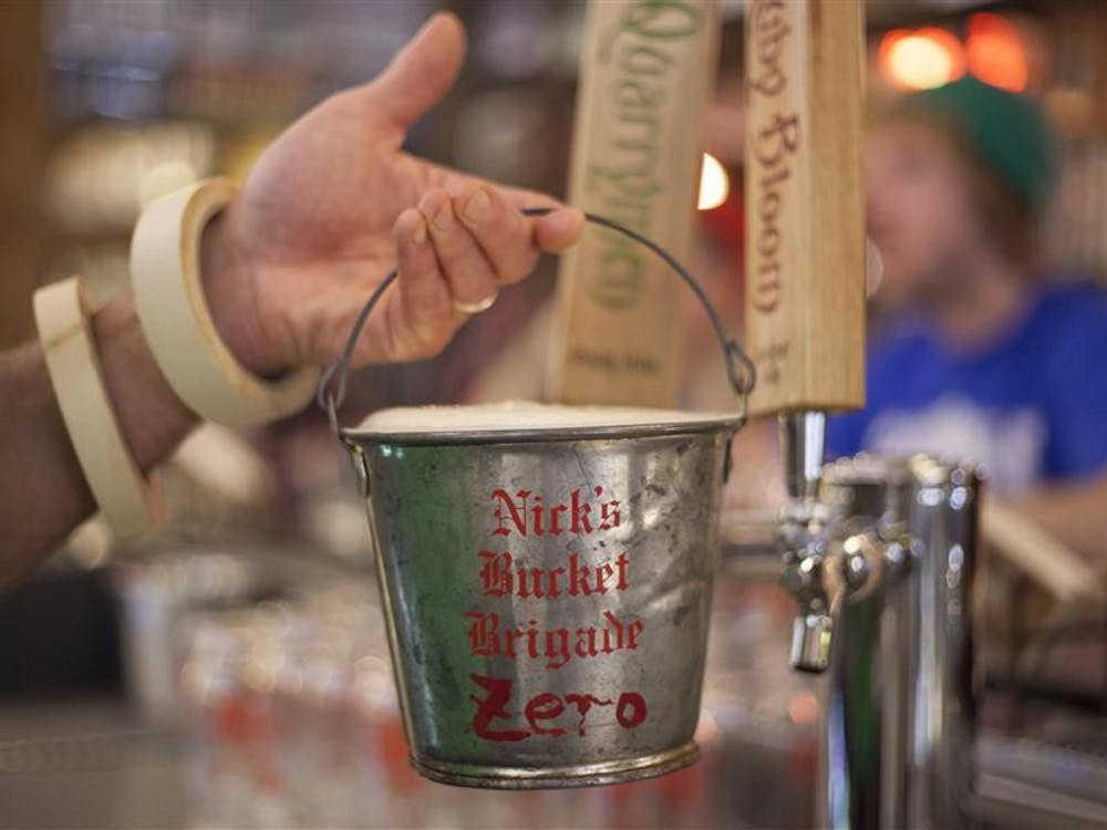 Nobody is quite sure whose idea it was to bring the buckets to Nick’s. The idea for a drinking club using buckets came from a bar someone visited in Wyoming in the early 1970s. The 120 tin buckets were hung on 120 hooks above the main bar for elite regulars.