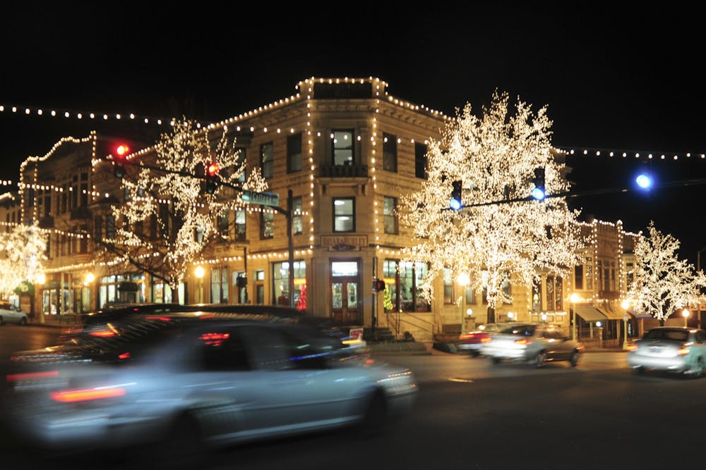 Cars drive under the Canopy of Lights in downtown Bloomington.