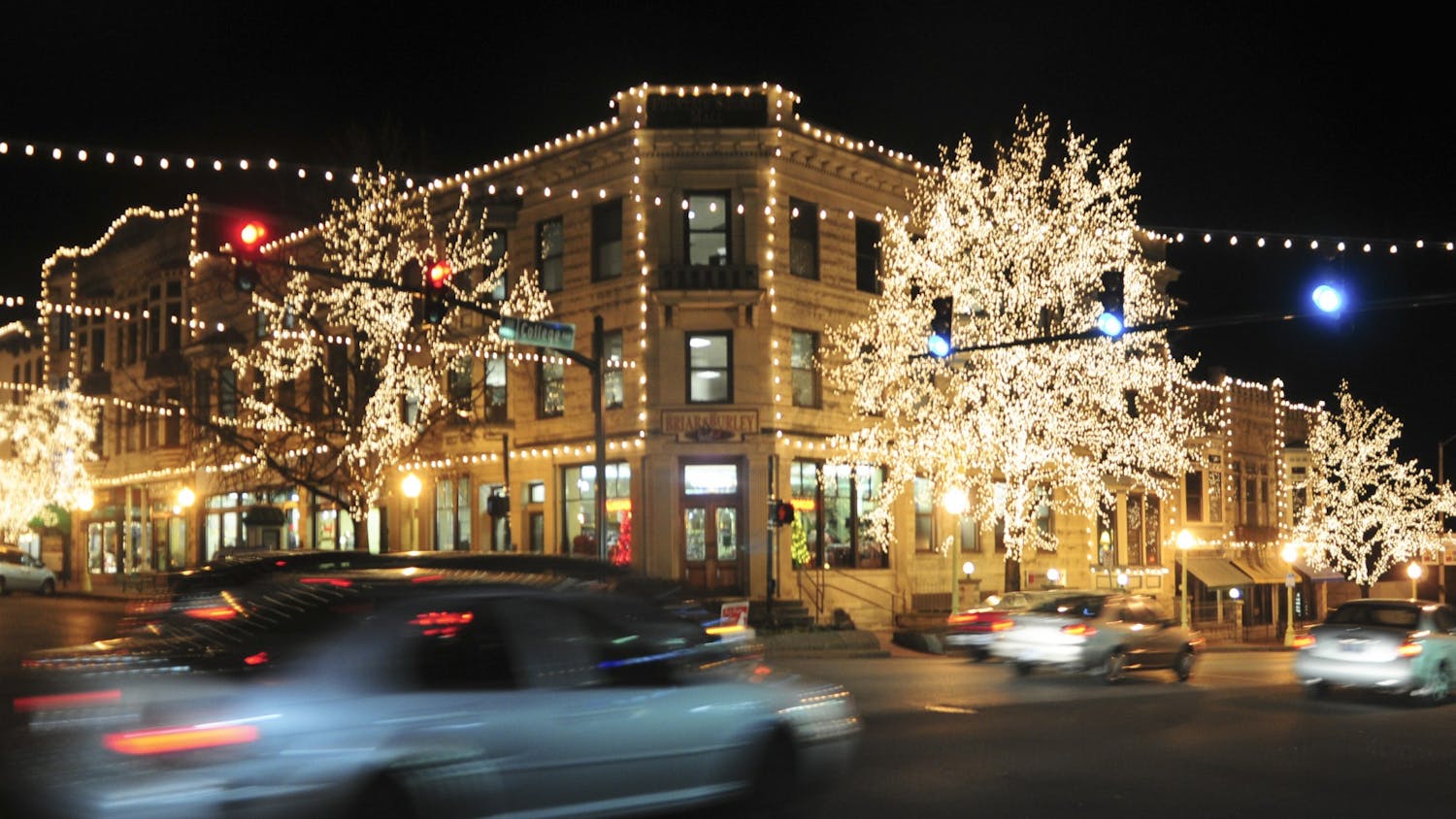 Cars drive under the Canopy of Lights in downtown Bloomington.