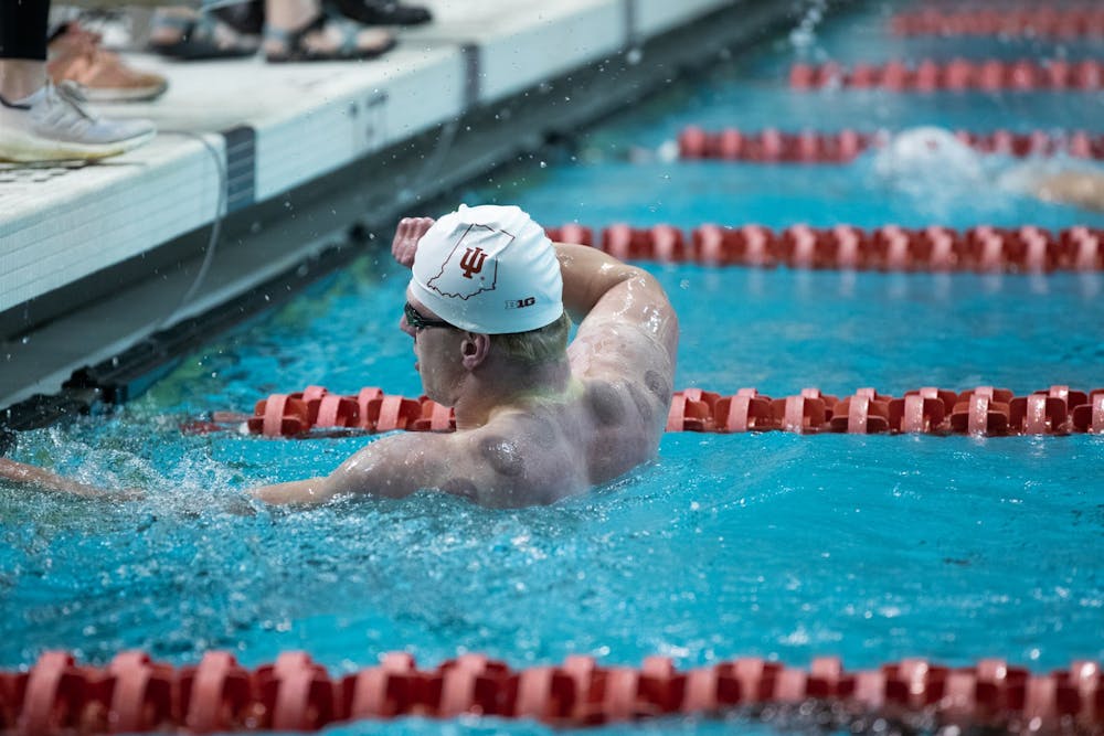 <p>Senior Michael Draves celebrates his win in the men&#x27;s 100-yard free race on Jan. 28, 2022. He was able to take first place followed by three Evansville swimmers. </p>