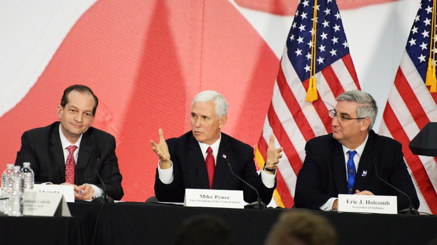 Vice President Mike Pence talks about tax reform during a roundtable discussion with Gov. Eric Holcomb, Sen. Todd Young, R-Indiana, and Secretary of Labor Alexander Acosta. The roundtable took place Thursday at TKO Graphix, a printing company in Plainfield, Indiana.