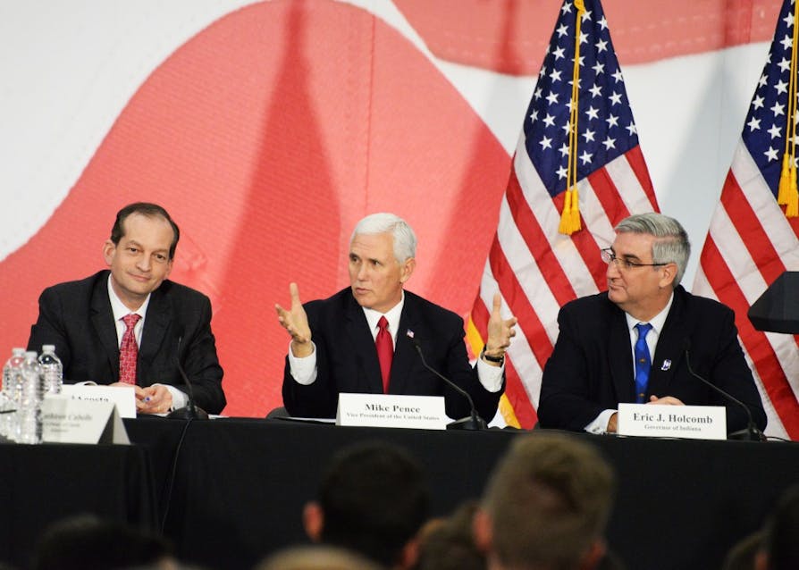Vice President Mike Pence talks about tax reform during a roundtable discussion with Gov. Eric Holcomb, Sen. Todd Young, R-Indiana, and Secretary of Labor Alexander Acosta. The roundtable took place Thursday at TKO Graphix, a printing company in Plainfield, Indiana.