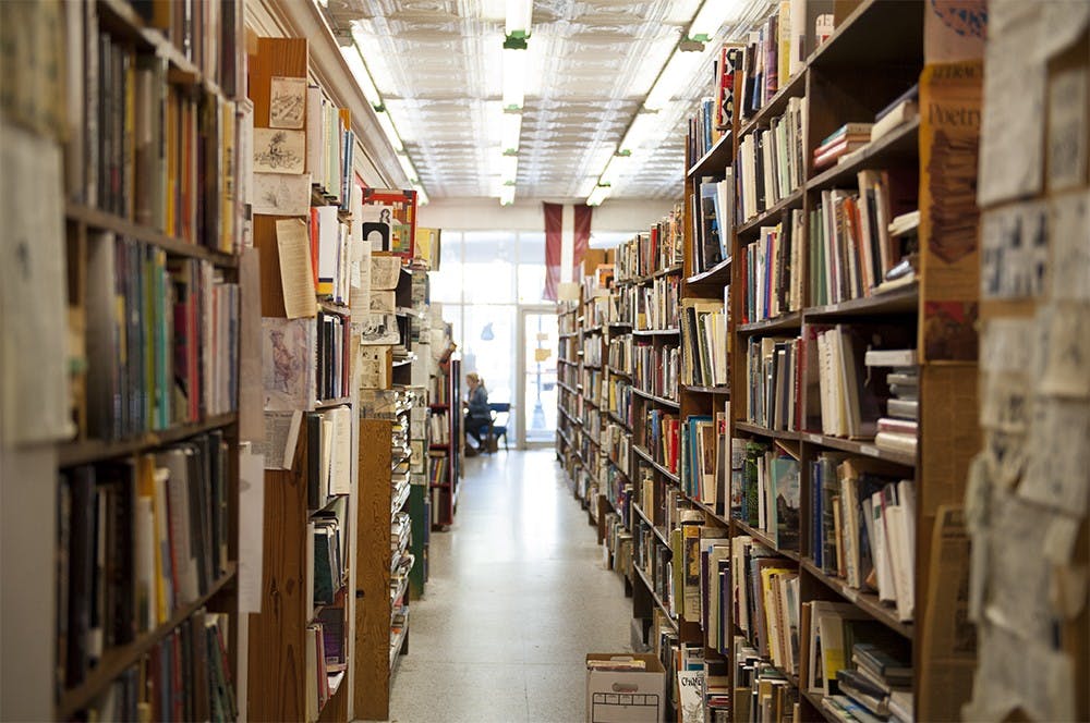 Numerous used books line the shelves of Caveat Emptor, a used book store on Walnut Street. This June will mark the business' 45th year.
