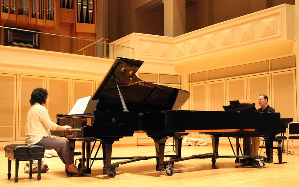 The Hammond Piano Duo, Marina Hammond and Fred Hammond, rehearses for their performance in Auer Hall. They are one of many performers for a concert celebrating  the life of Professor Alfonso Montecino with Latin American music on September 8 at 8p.m. in Auer Hall.