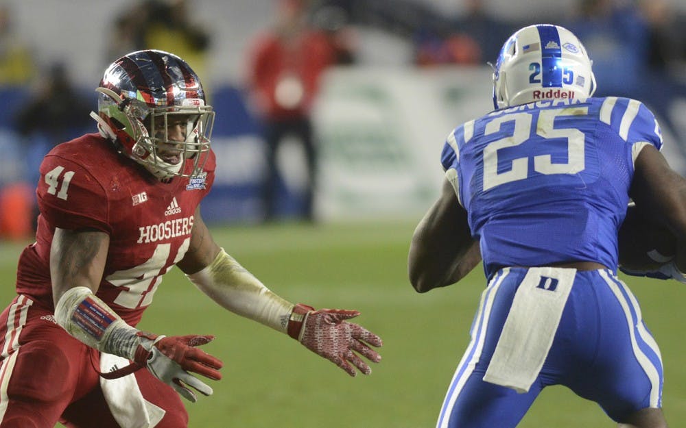 Then-junior Clyde Newton attempts to tackle Duke running back Jela Duncan during the Pinstripe Bowl on Dec. 26, 2015 at Yankee Stadium. Newton transitioned to running back after spring practice and will play his first game at the position in Miami against FIU.